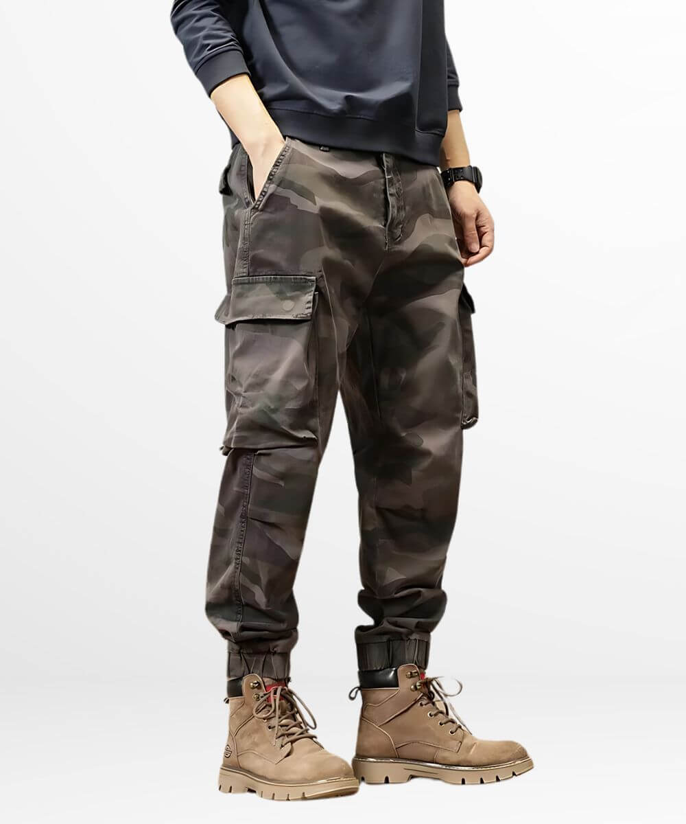 Front view of grey baggy camo cargo pants paired with rugged lace-up boots.