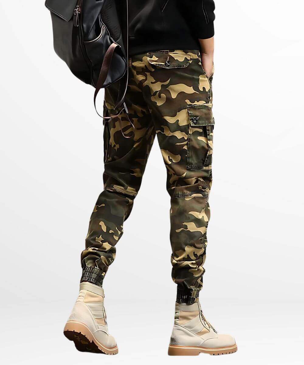 Back view of men's slim-fit khaki camo cargo pants showcasing pocket details and beige combat boots.