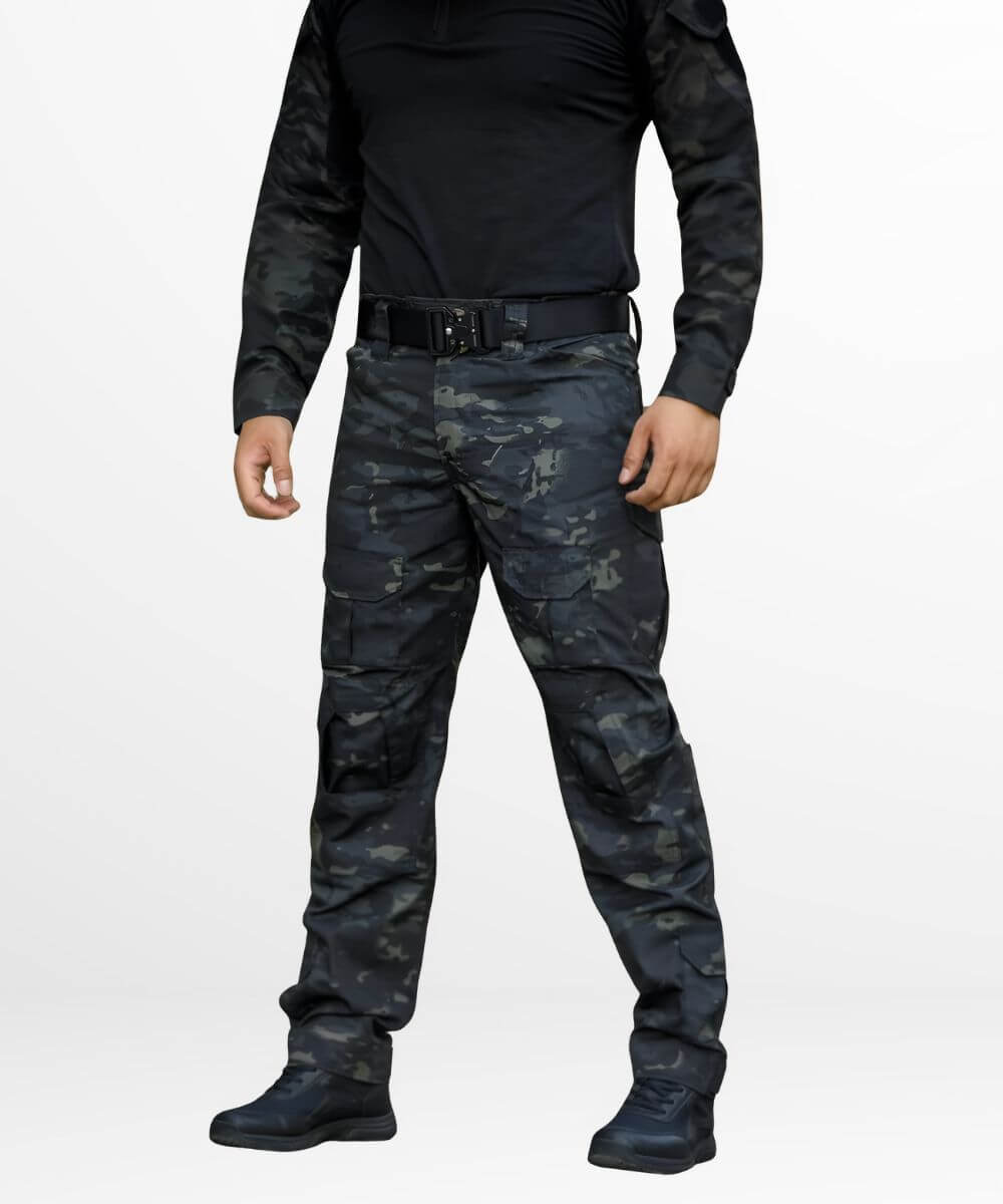 Side profile of men's army camo cargo pants, emphasizing the fit and side cargo pockets, completed with tactical boots for an outdoor-ready ensemble.
