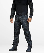 Side profile of men's army camo cargo pants, emphasizing the fit and side cargo pockets, completed with tactical boots for an outdoor-ready ensemble.