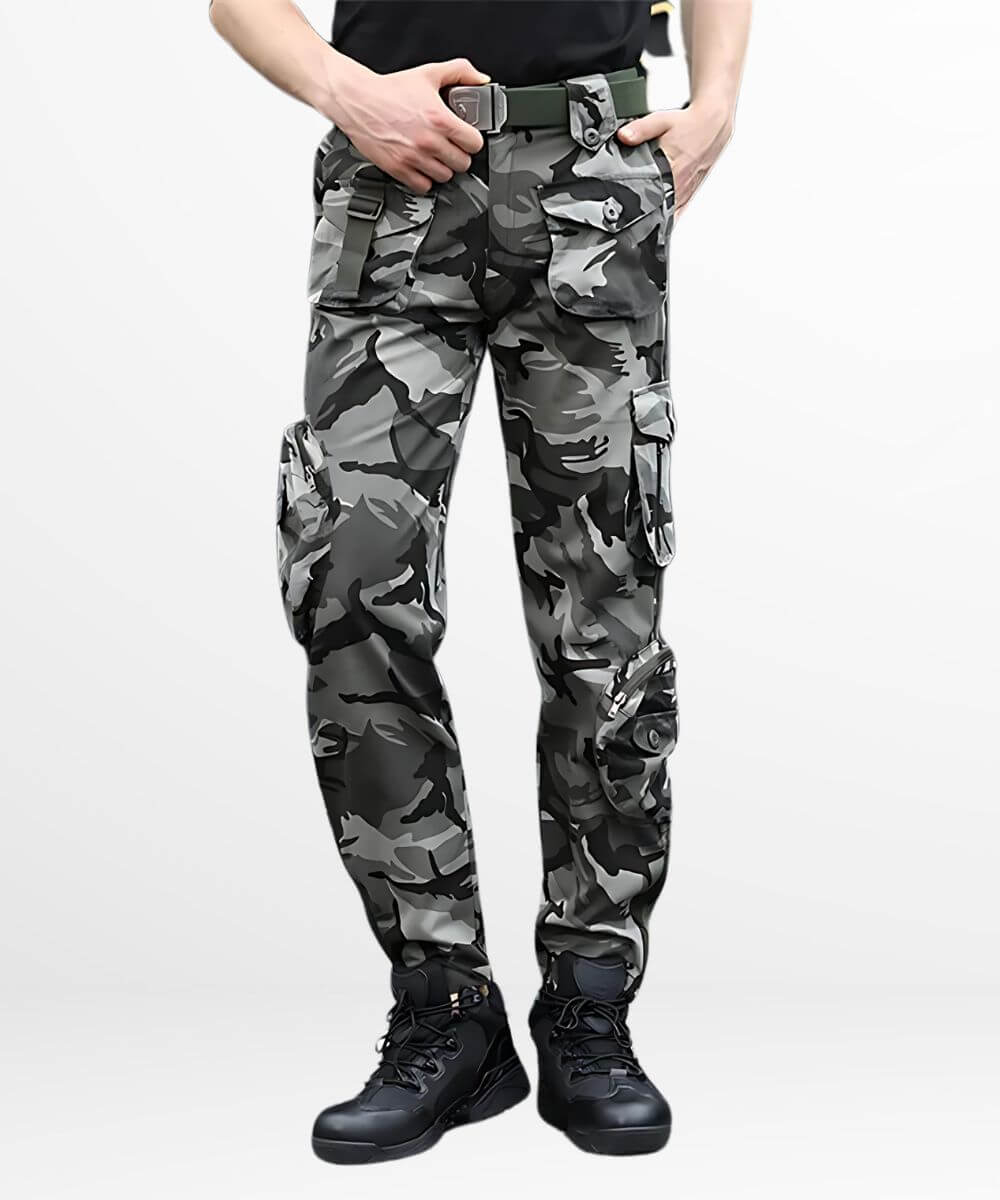 Men's black and white camo cargo pants in a tactical streetwear style, paired with black boots.