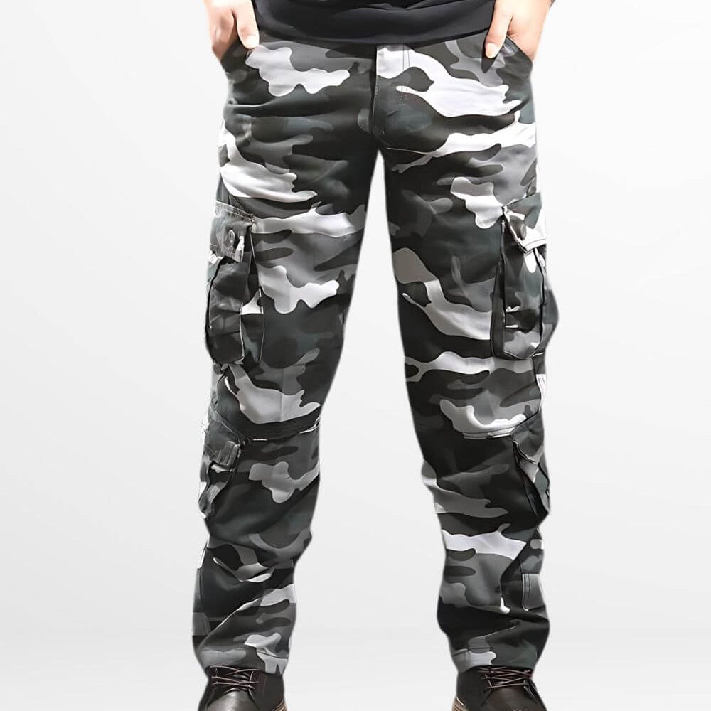 Front view of men's blue camouflage cargo pants with detailed pockets and rugged boots.