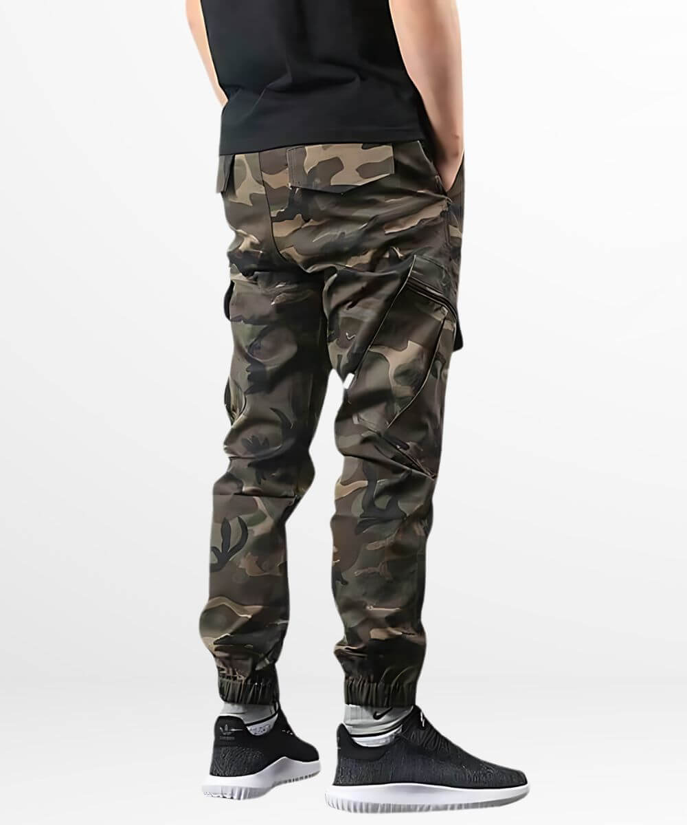 Rear view of men's cargo camo pants highlighting the detailed pocket design and black casual sneakers.