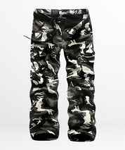 Men's cargo camouflage pants in a striking black and white design with multiple pockets for functional outdoor wear.