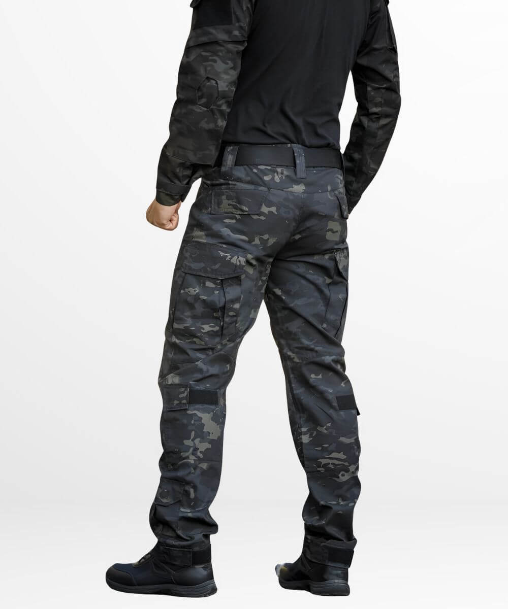 Full outfit showcasing men's dark camo cargo pants paired with a black tactical top and boots, ideal for military-inspired fashion.