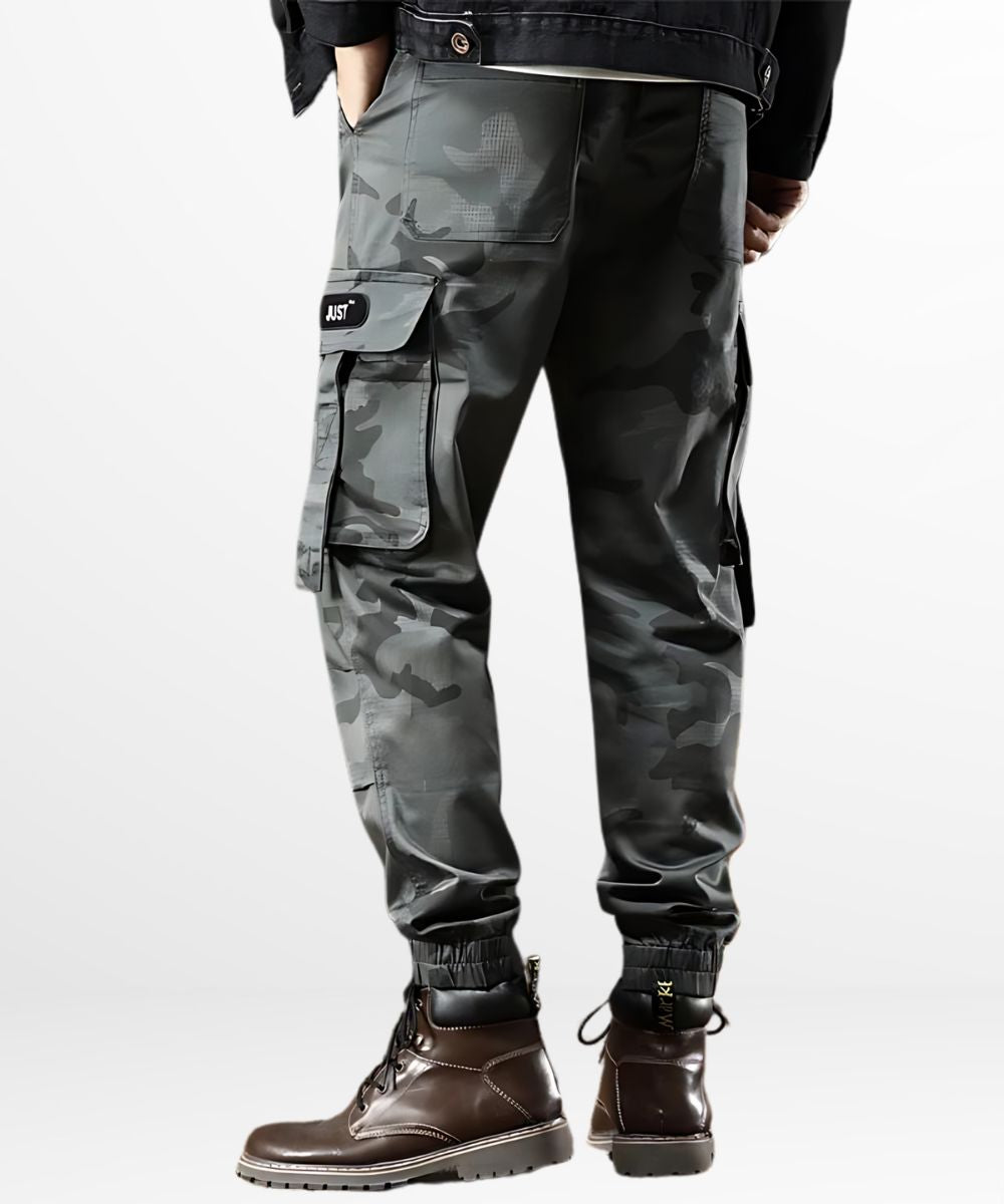 Back view of Men's Grey Camo Cargo Pants with cuffed ankles paired with stylish brown boots.