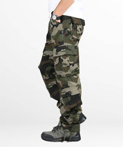 Angled pose of men's hunting camo pants detailing the fit and pocket layout.