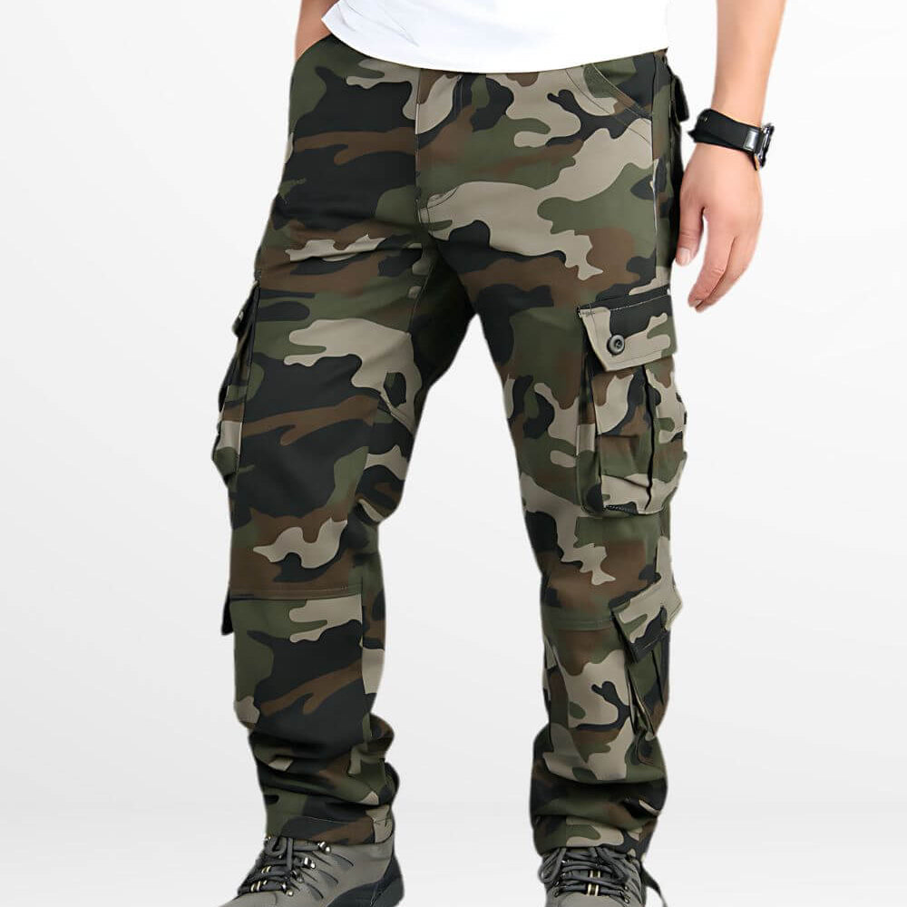 Front view of men's hunting camo pants with secure belt and tactical boots.