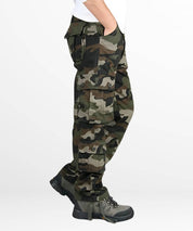 Side view of men's hunting camo pants showcasing side pockets and rugged design.