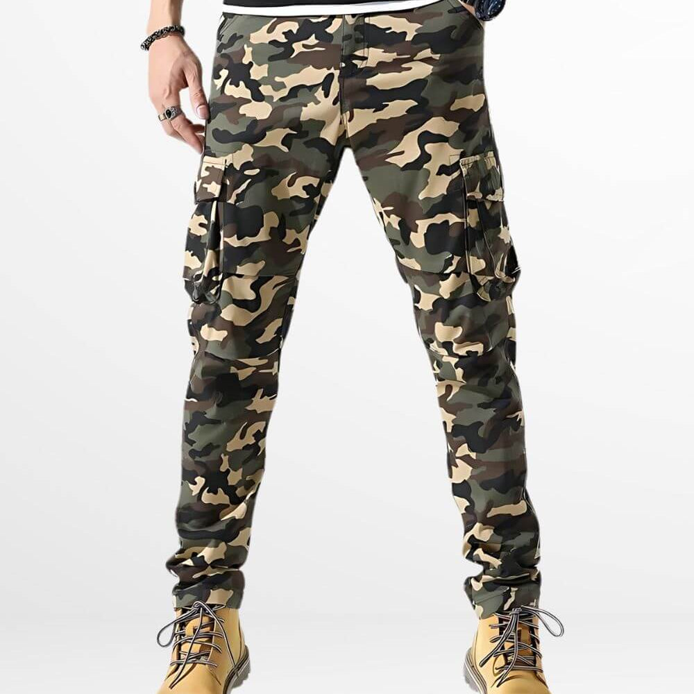 Front view of men's skinny camouflage cargo pants paired with yellow boots.
