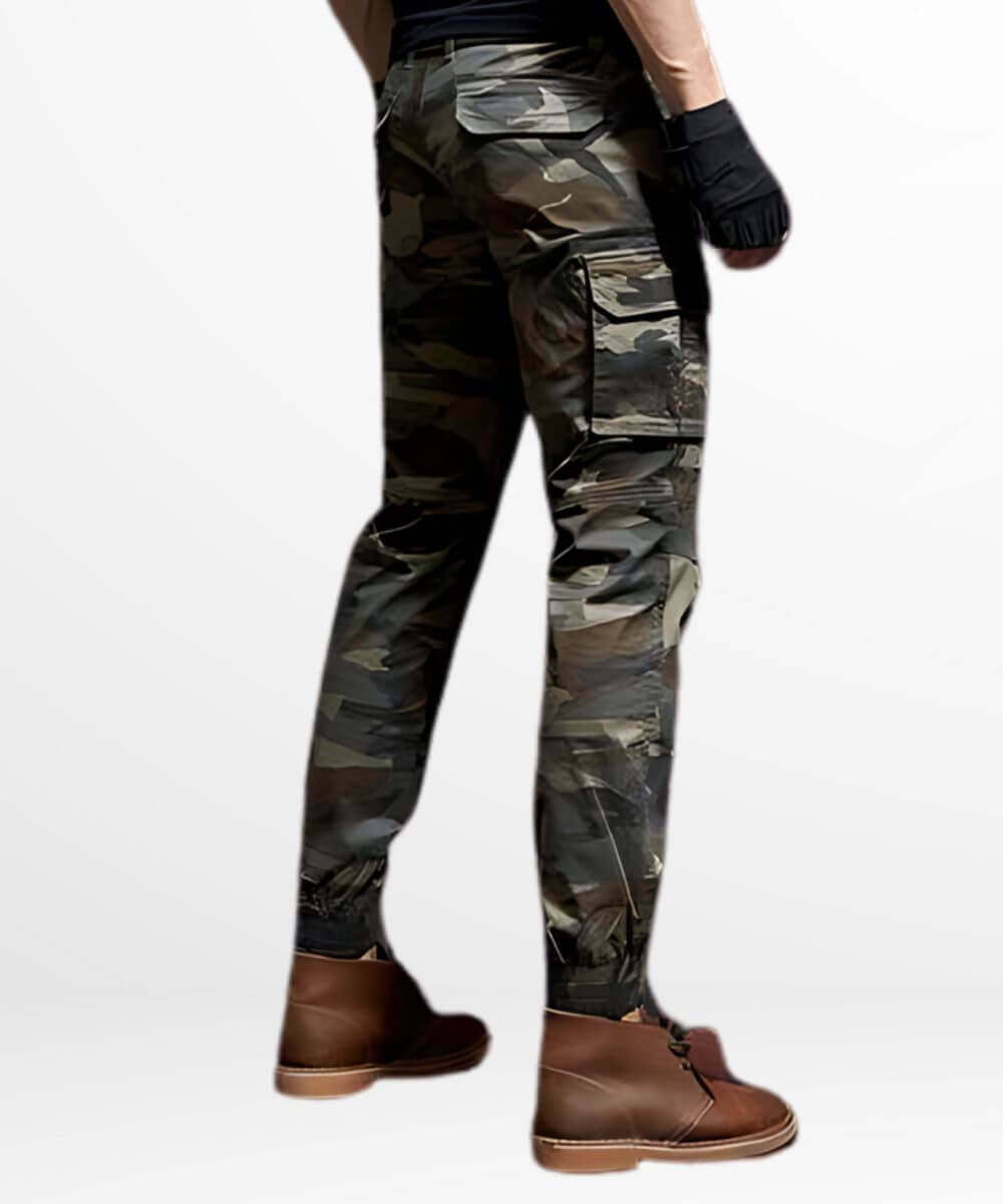 Side view of men's slim-fit camo cargo pants highlighting the side pockets and tactical design, complemented with casual brown leather boots.