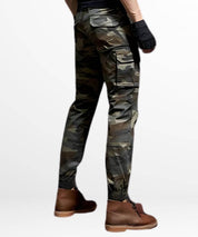 Side view of men's slim-fit camo cargo pants highlighting the side pockets and tactical design, complemented with casual brown leather boots.
