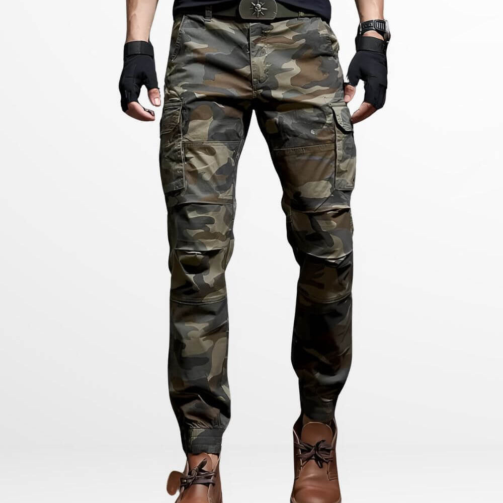 A pair of men's slim-fit camo cargo pants featuring a utility design with multiple pockets and a comfortable fit, paired with brown work boots.