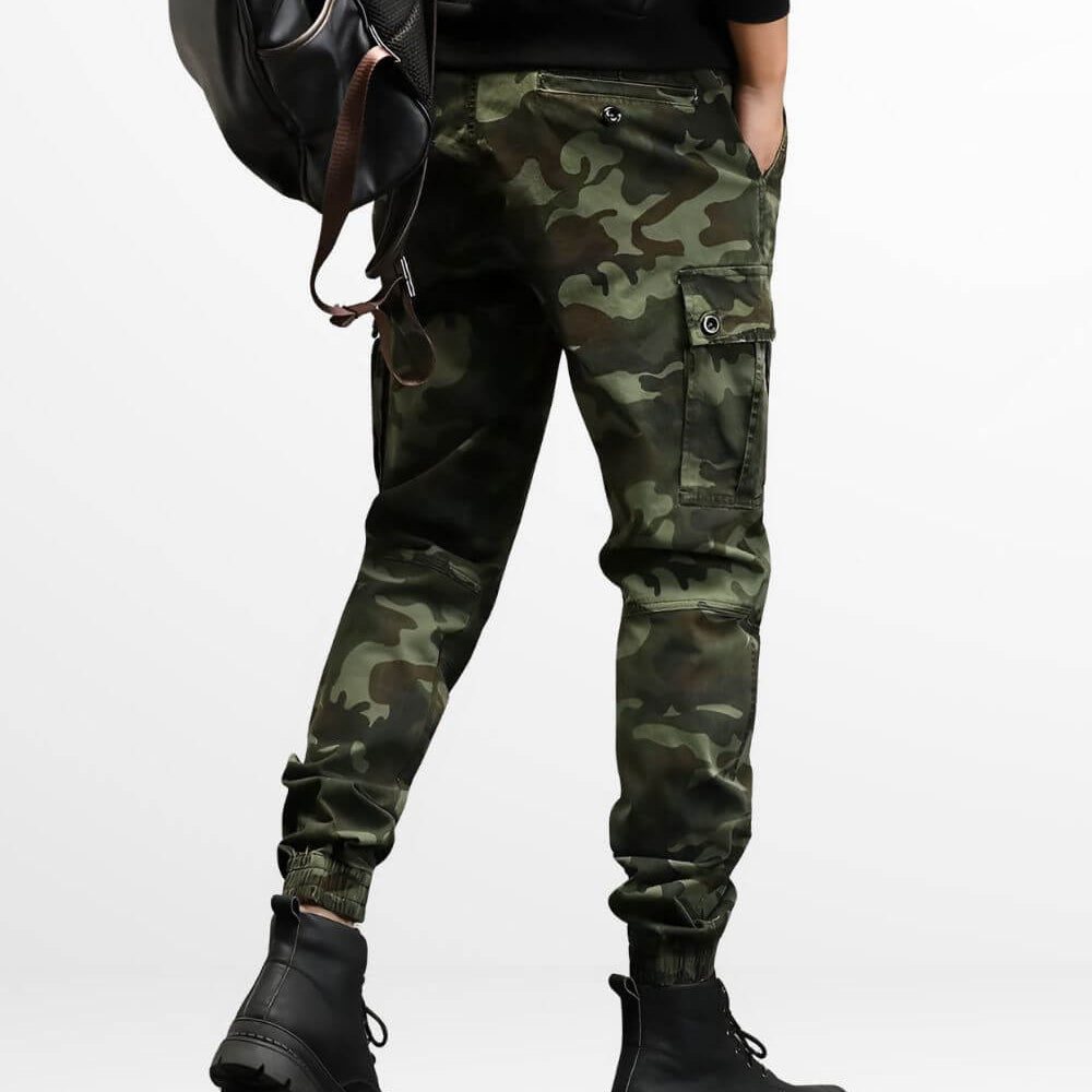 Rear view of military-style camo cargo pants with secure flap pockets and a black leather belt.