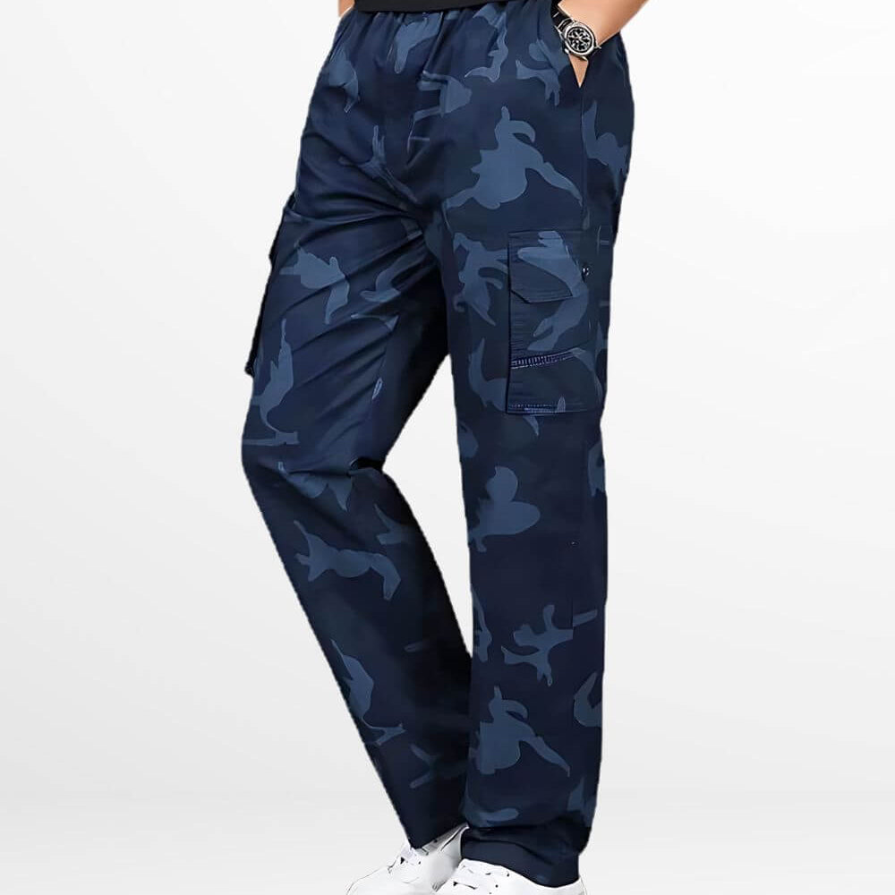 Fashionable navy blue camo cargo pants paired with classic white sneakers, featuring a modern cut and pocket details for a streetwise look.
