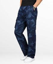 Fashionable navy blue camo cargo pants paired with classic white sneakers, featuring a modern cut and pocket details for a streetwise look.