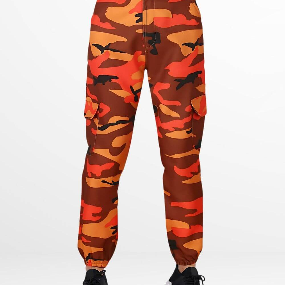Woman wearing street-style orange and black camo pants paired with black sneakers.