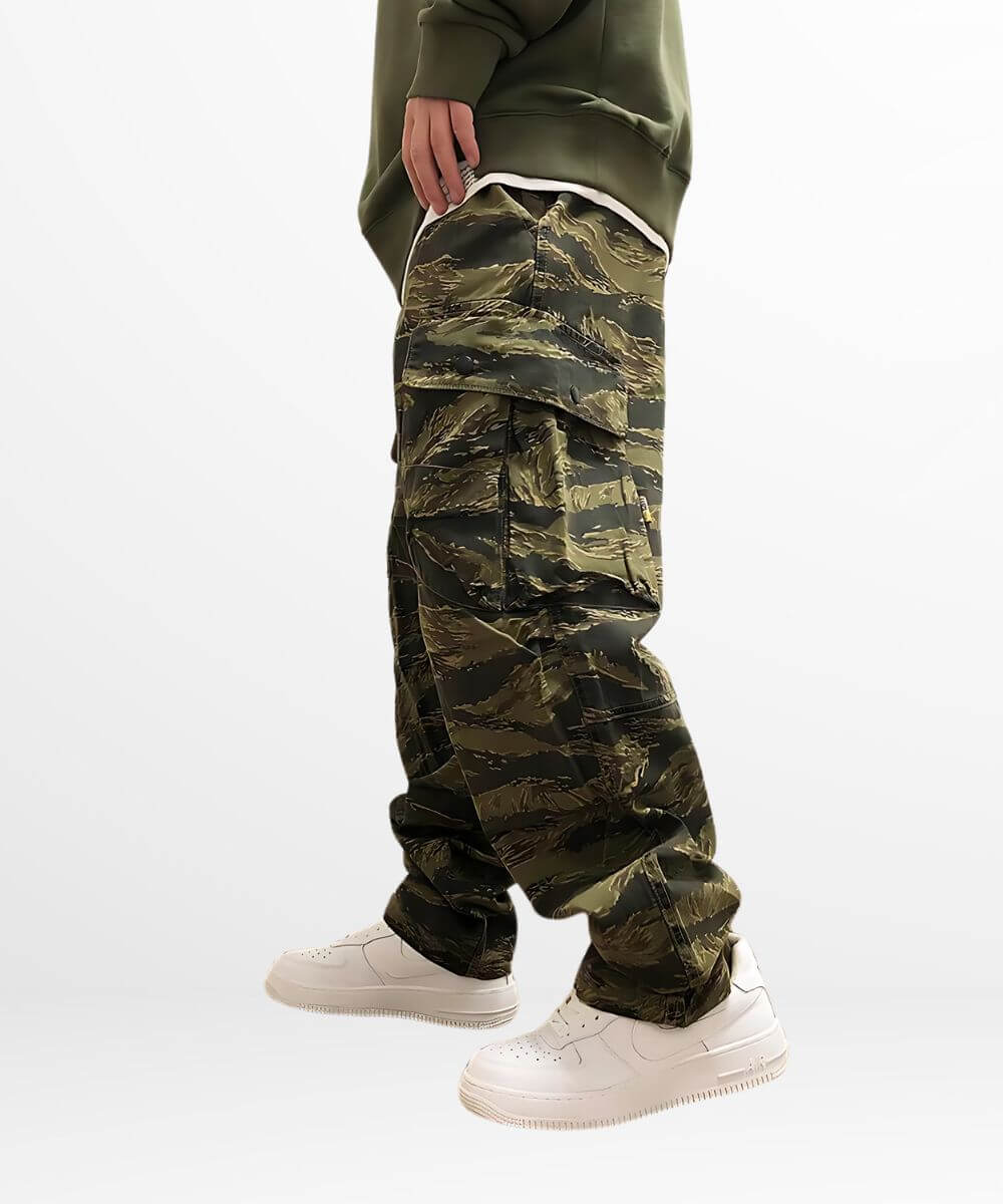 Person showcasing a relaxed fit with baggy camouflage cargo pants and a tucked-in sweatshirt.