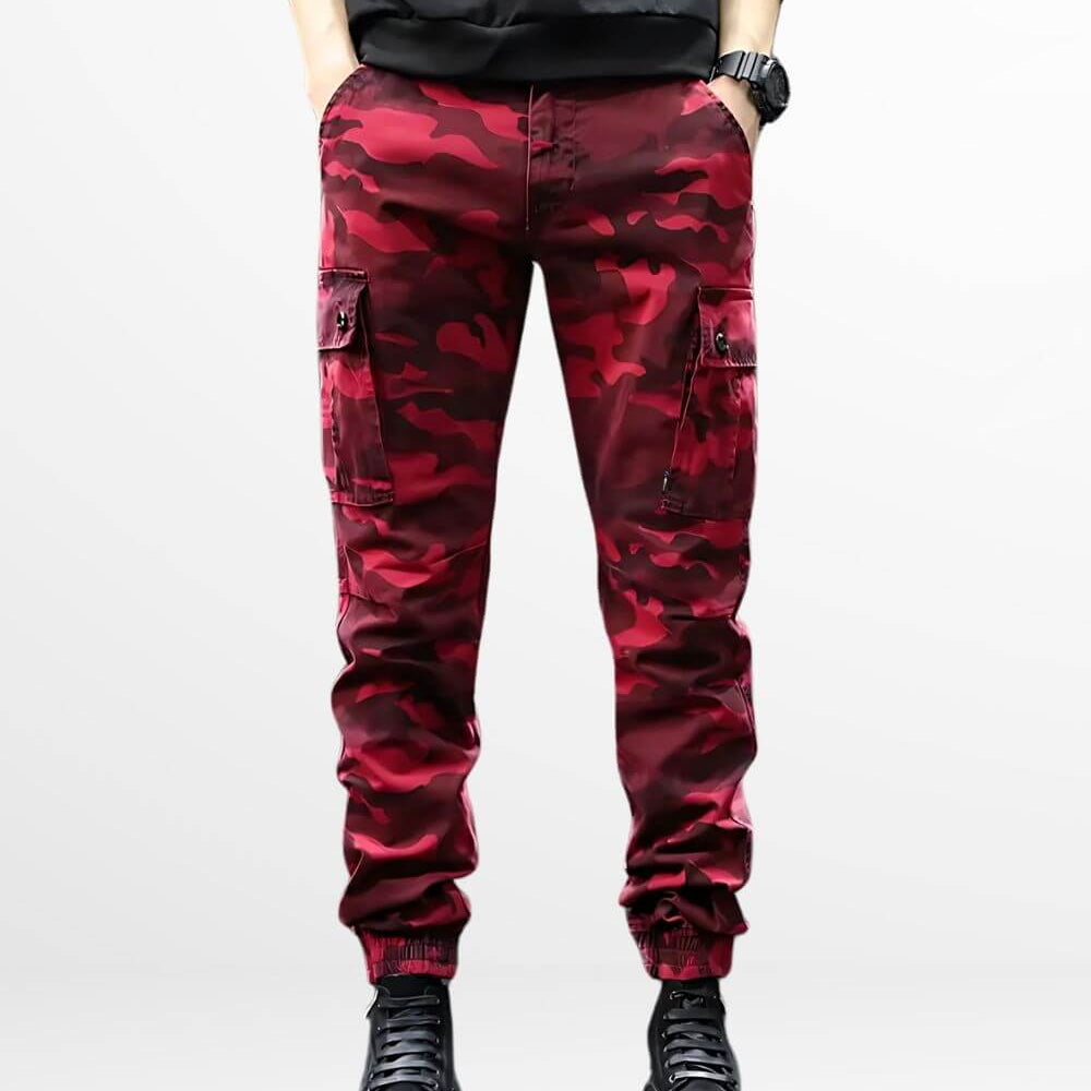Man wearing Red Camo Cargo Pants Mens in front view paired with stylish black combat boots.