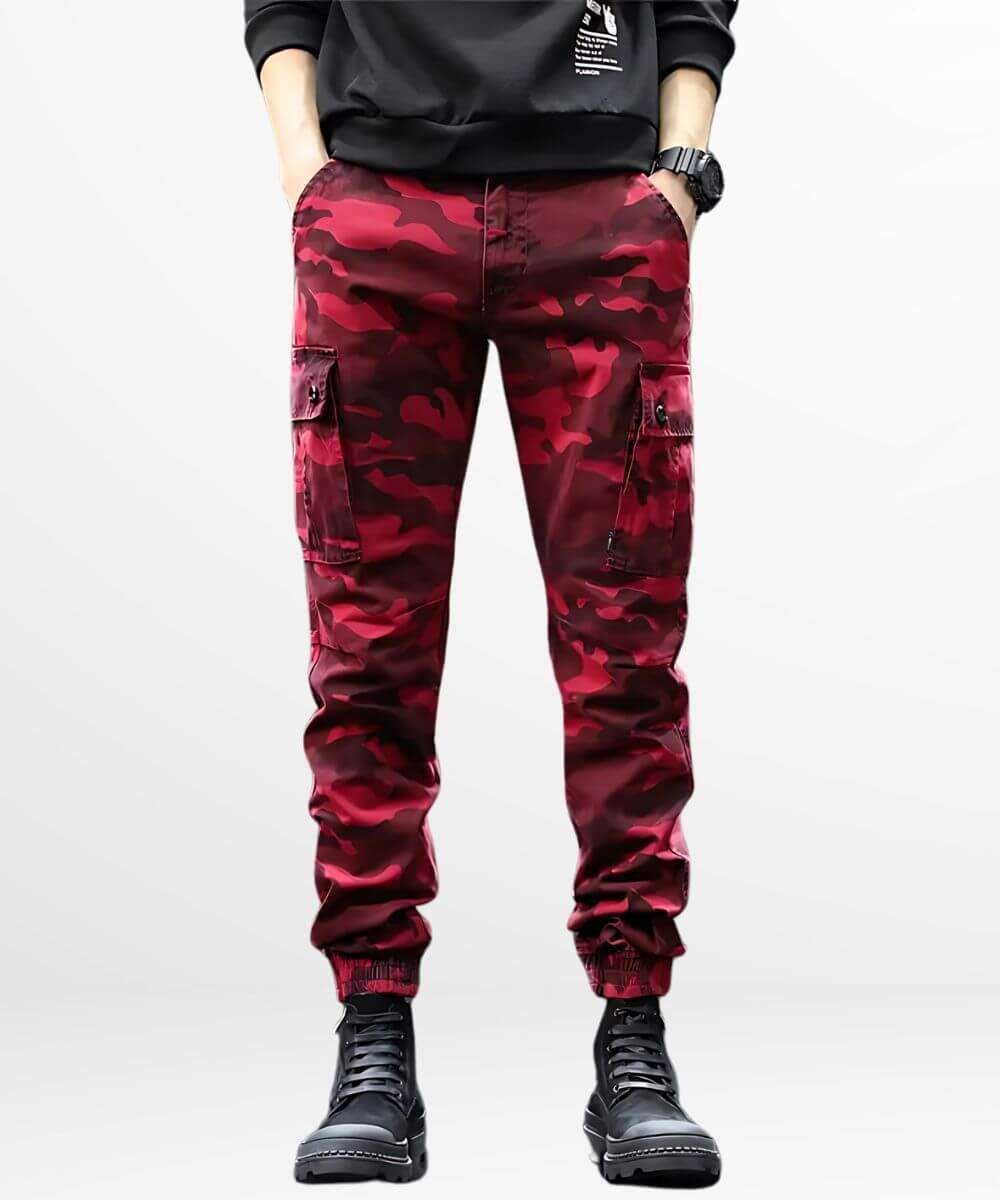 Man wearing Red Camo Cargo Pants Mens in front view paired with stylish black combat boots.