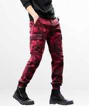 Side pose showing pocket detail of Red Camo Cargo Pants Mens with black boots for a modern outfit.