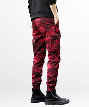 Casual side view of Red Camo Cargo Pants Mens with contemporary black boots.