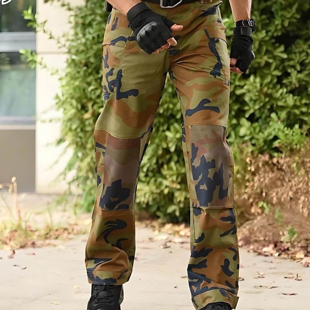 Man wearing jungle camouflage pants, styled for practical outdoor activities.