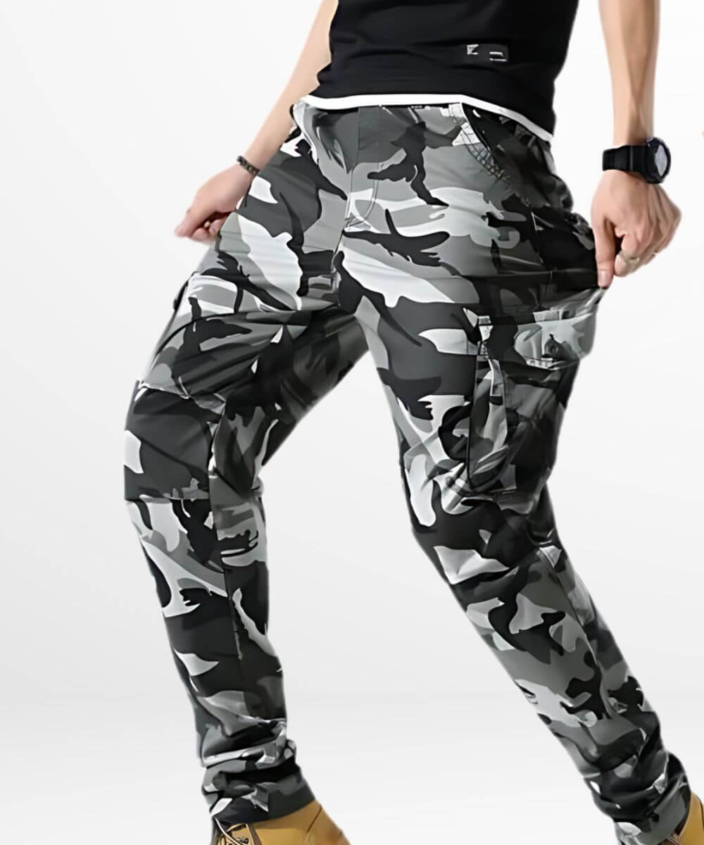 Side angle view of men's grey and black skinny camo cargo pants showcasing pocket details.