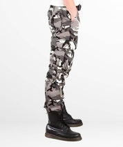 Side view of men wearing white and black camo cargo pants, highlighting the cargo pockets.