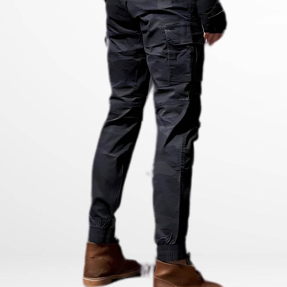 Back view showcasing the fit and pocket detailing of slim camo cargo pants for men, complemented with brown ankle boots.