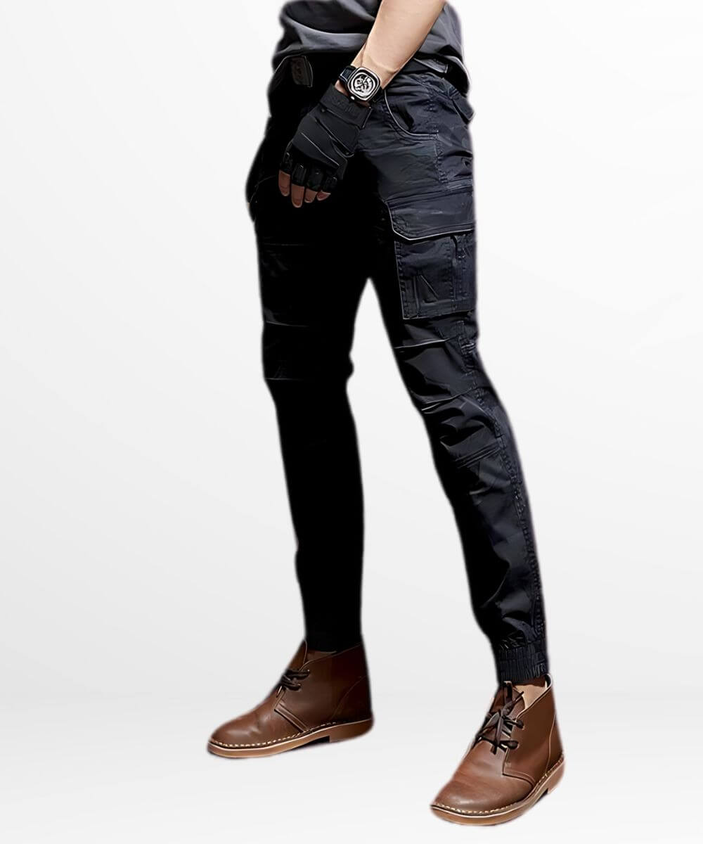 Side profile of slim camo cargo pants for men highlighting the snug cuff design and side pockets, styled with brown leather boots.