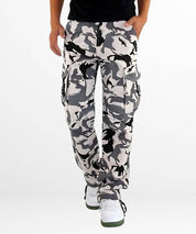Fashionable snow camo cargo pants styled with white sneakers, perfect for a trendy urban look.