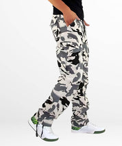 Modern urban outfit featuring snow camo cargo pants paired with stylish white sneakers, highlighting practical design with a fashionable twist.