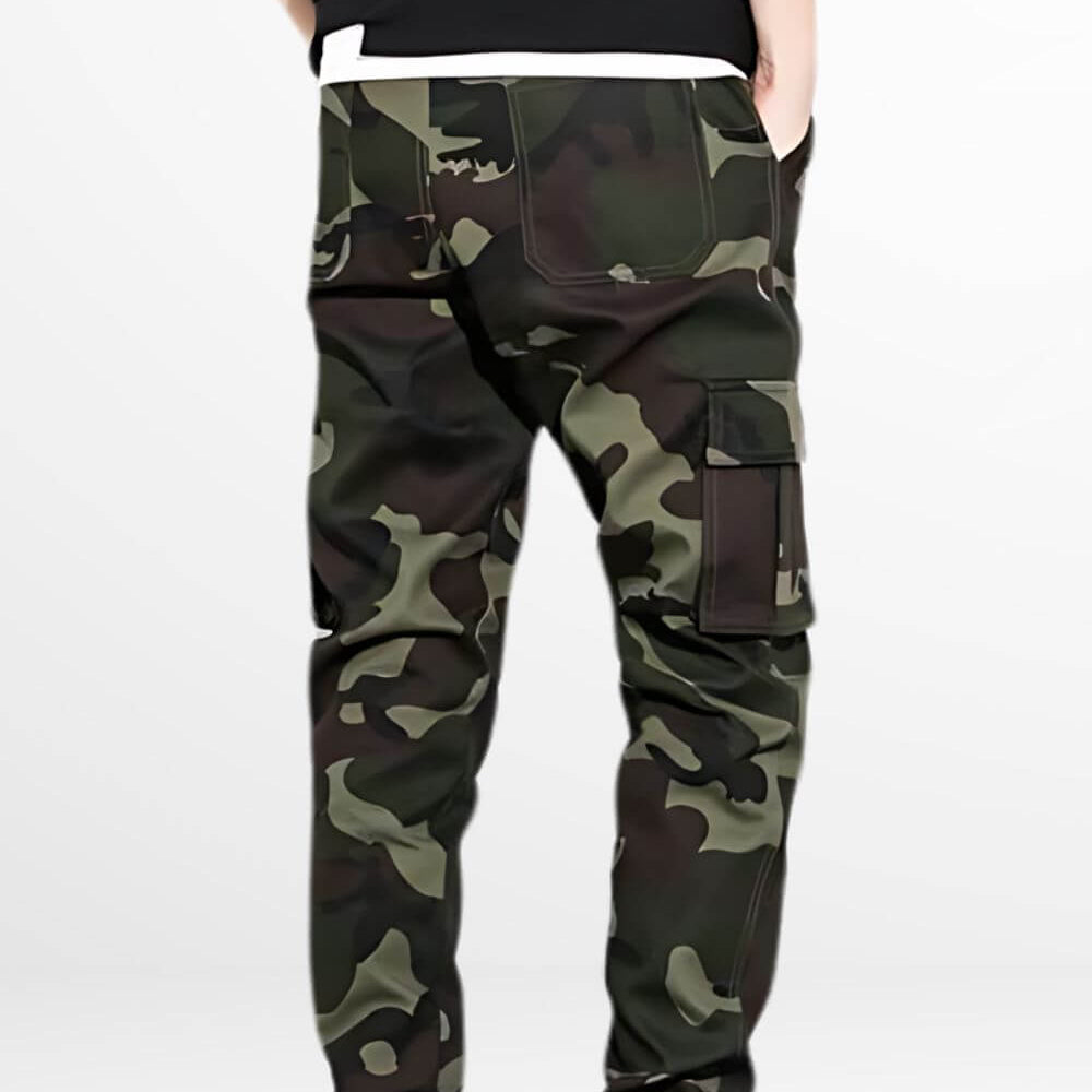 Green camo pants mens fit seen from the back, perfectly styled with white sneakers for a contemporary streetwear outfit.