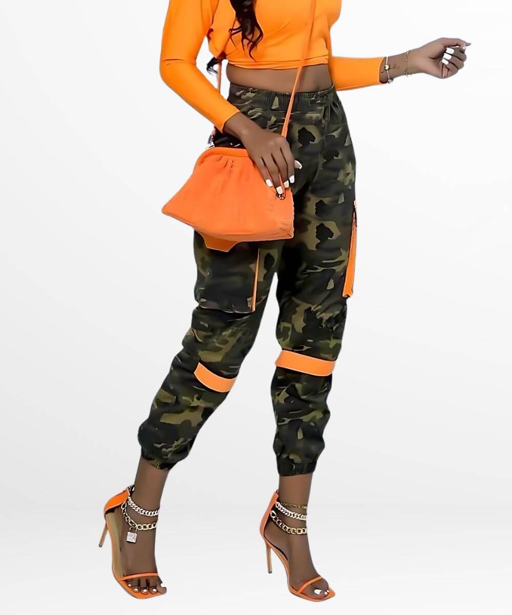 Trendy women's camo pants with orange detailing, showcasing a perfect balance of edgy military and modern street style.