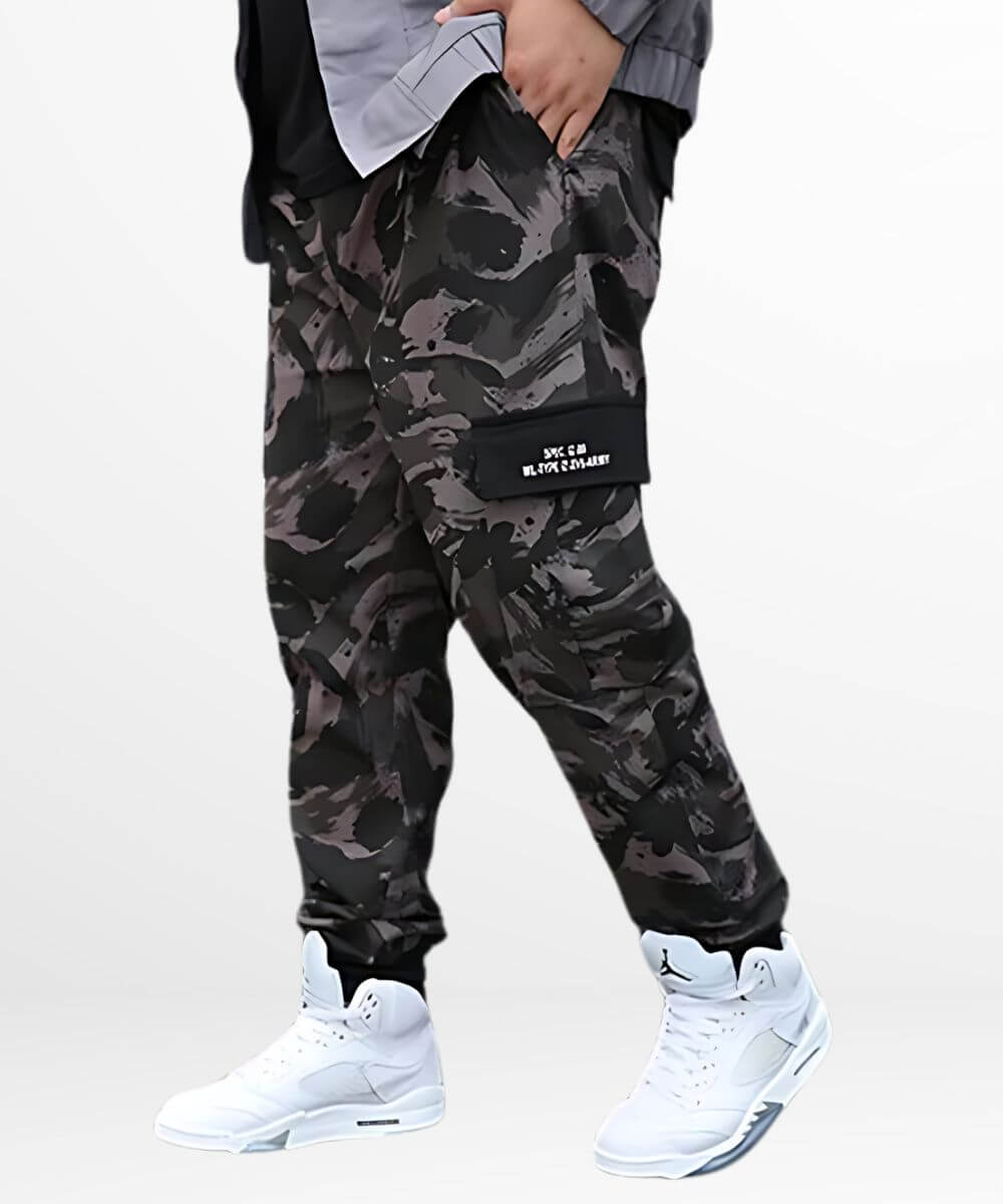 Side view of men's urban-style camouflage baggy pants complemented with crisp white sneakers.