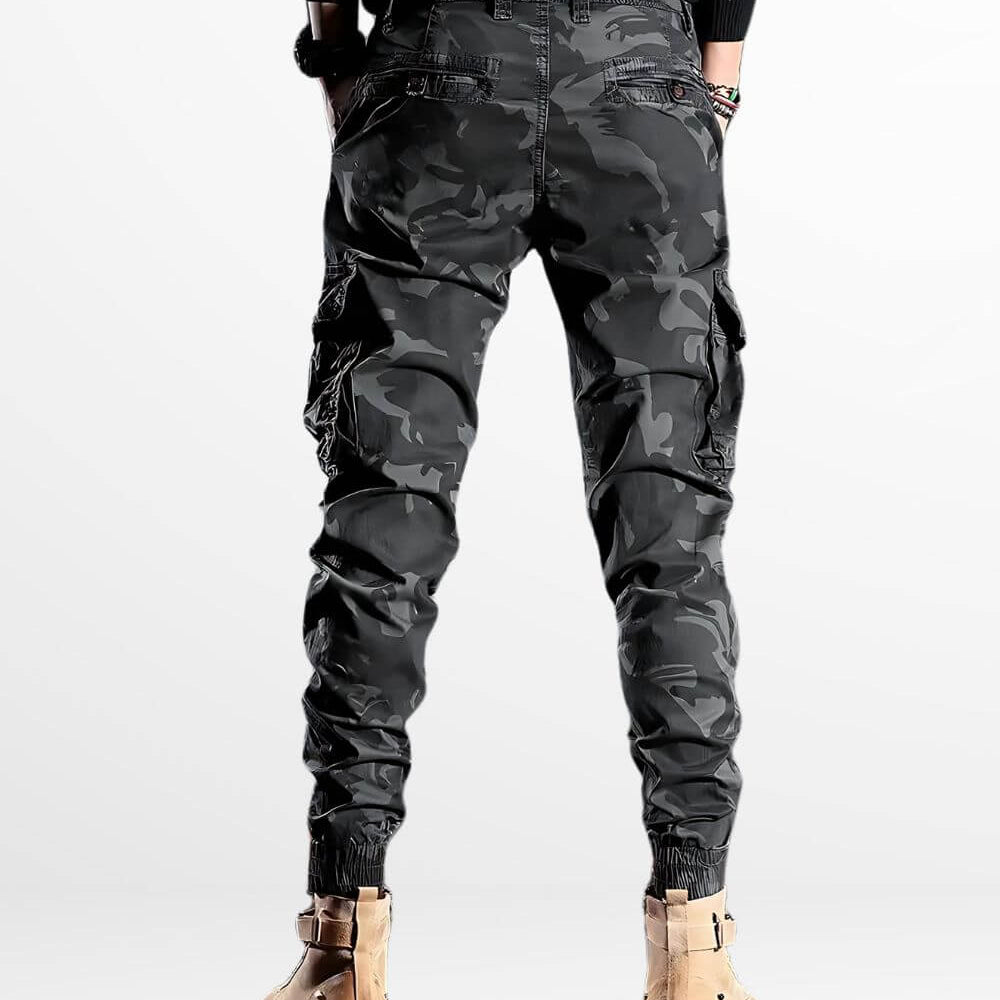 Back view of slim camo cargo pants in urban style, detailed with utility pockets and ribbed ankle cuffs.