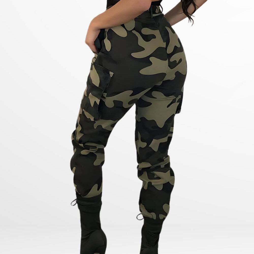 Back view of women's stylish green camo pants accented with black heeled boots and a detailed lace bodysuit, emphasizing a bold fashion statement.