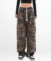 A relaxed fit showcase of women's baggy camo pants with a comfortable waistband and a casual black top.