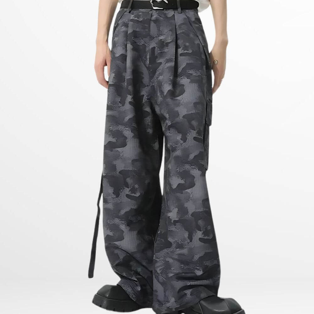 Front view of women's baggy camouflage pants featuring loose fit and stylish pockets, paired with a white belt and black boots.