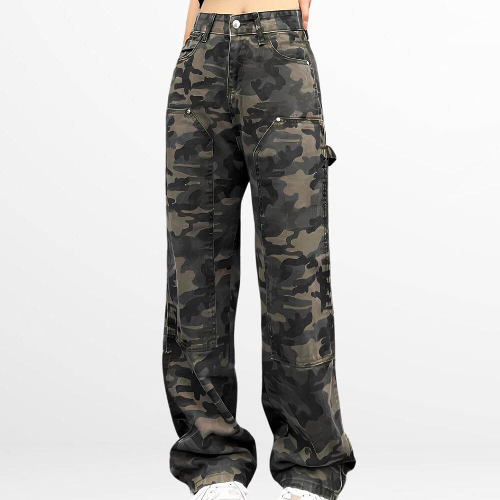 Front view of high-waisted camouflage cargo pants for women with white sneakers.