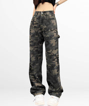 Front view of high-waisted camouflage cargo pants for women with white sneakers.