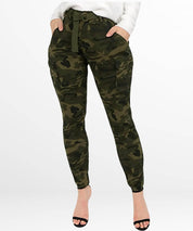 Elegant and modern high-waisted camo cargo pants for women, paired with simple black strap sandals, showcasing a blend of military chic and femininity.