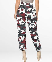 Rear view of womens red camo cargo pants featuring pocket detailing and a button-up side design.