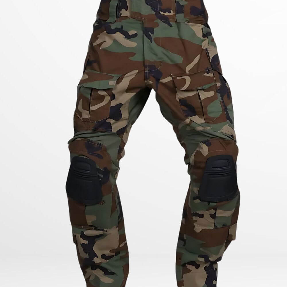 Front view of woodland camo cargo pants featuring multiple pockets and black knee pads, ideal for outdoor activities.