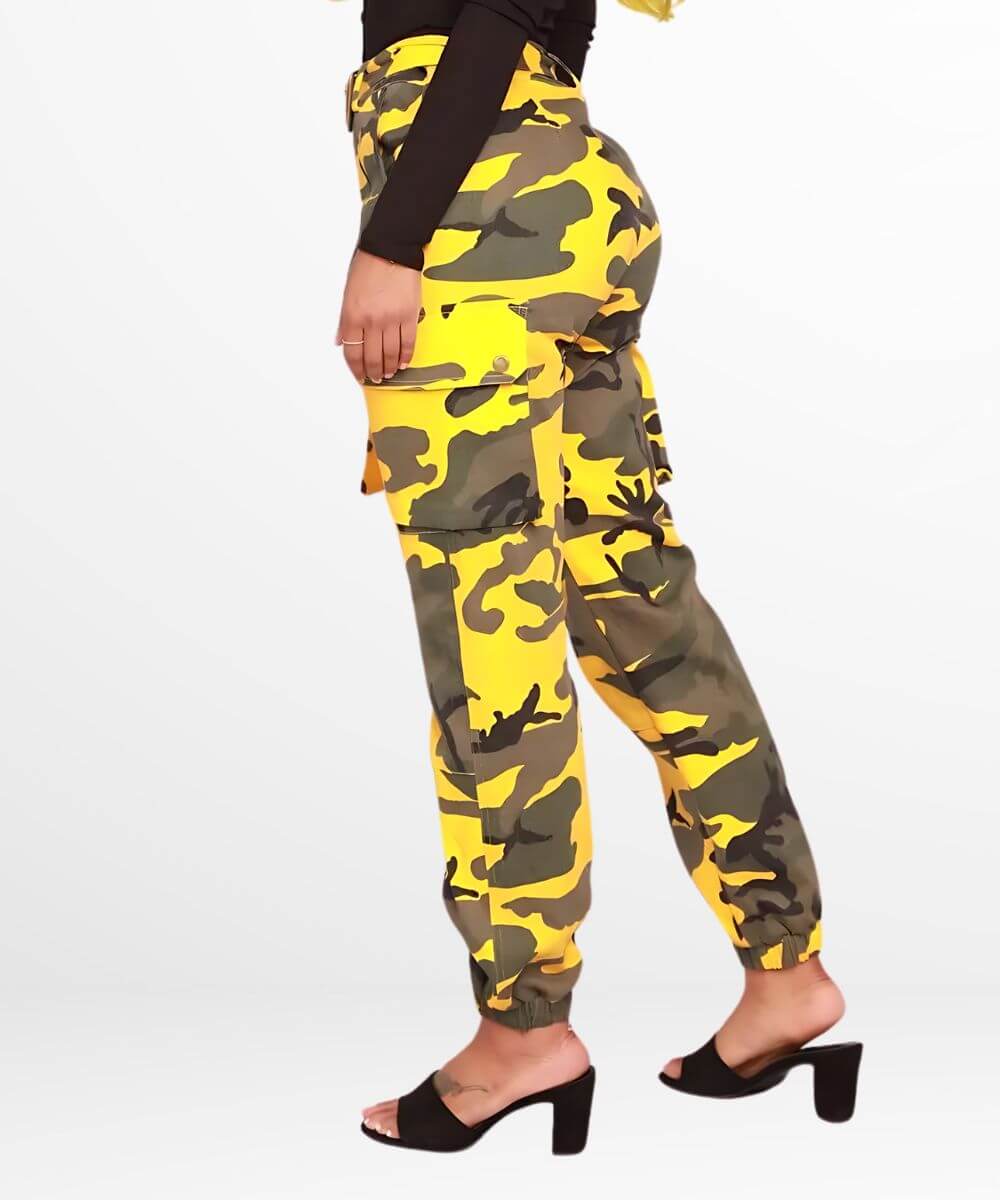 Side view of a woman in yellow camo pants showing the cargo pocket details and a black high-heel sandal.